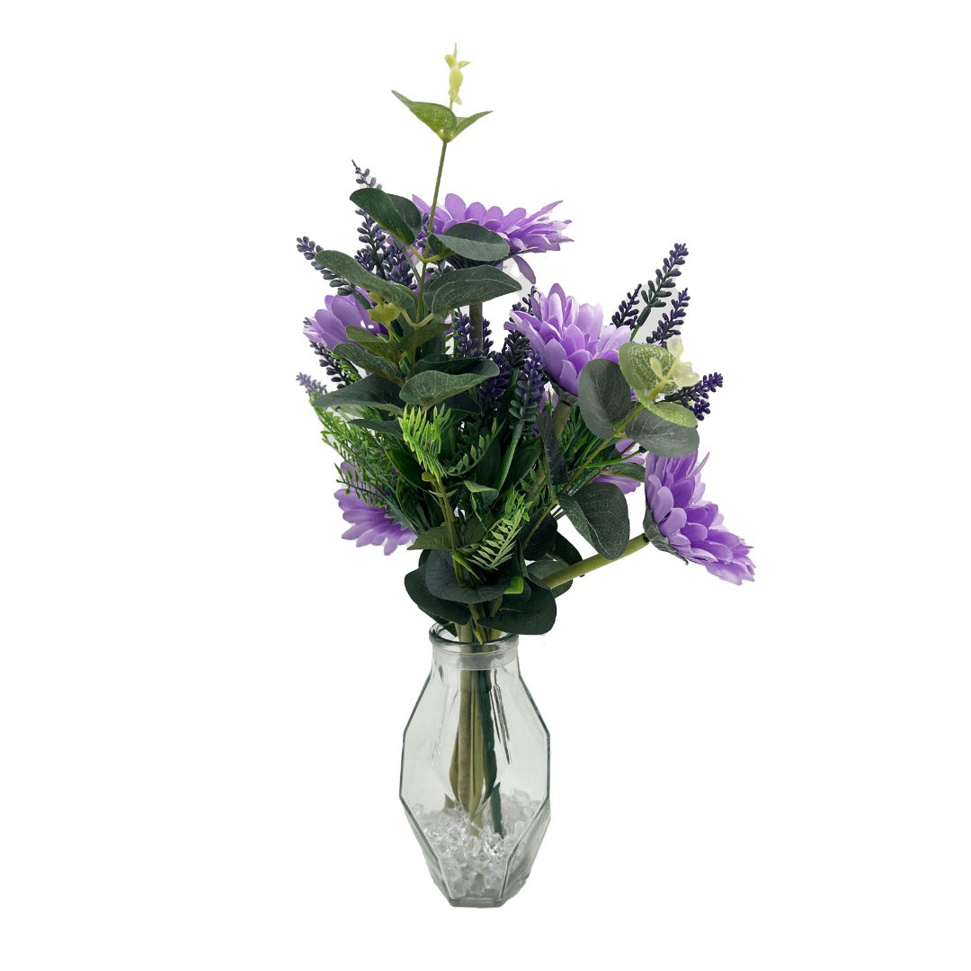 Lilac gerbera artificial flower arrangement in geometric glass vase front view