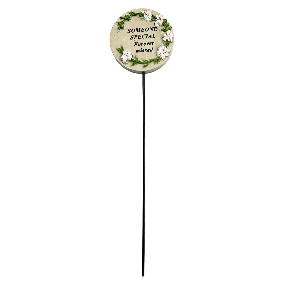 Someone Special white lily circle memorial tribute stick close up