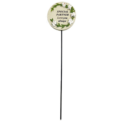 Special Partner white lily circle memorial tribute stick close up