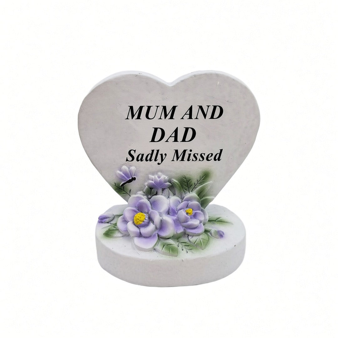 Mum and Dad Sadly Missed white heart memorial with purple flowers front view