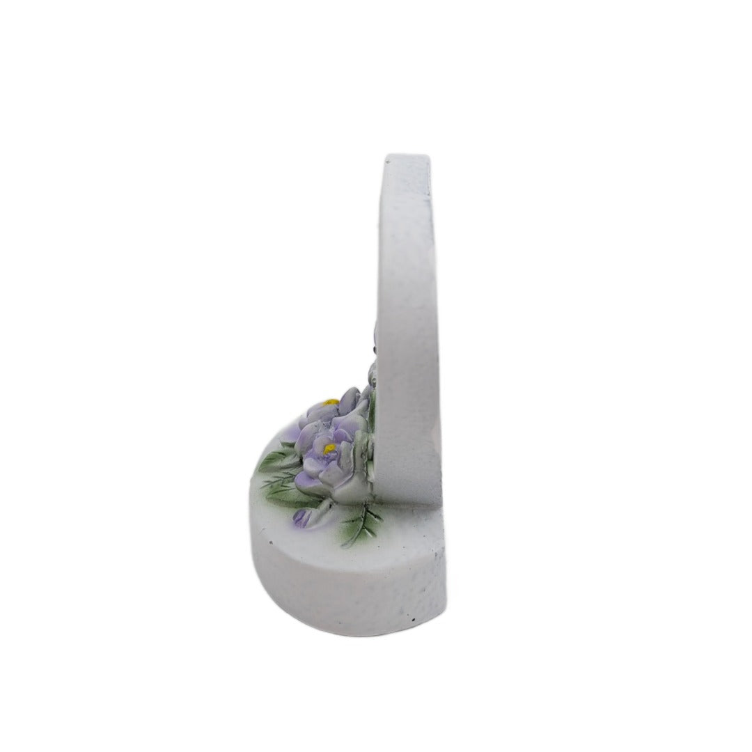 Mum and Dad Sadly Missed white heart memorial with purple flowers side view