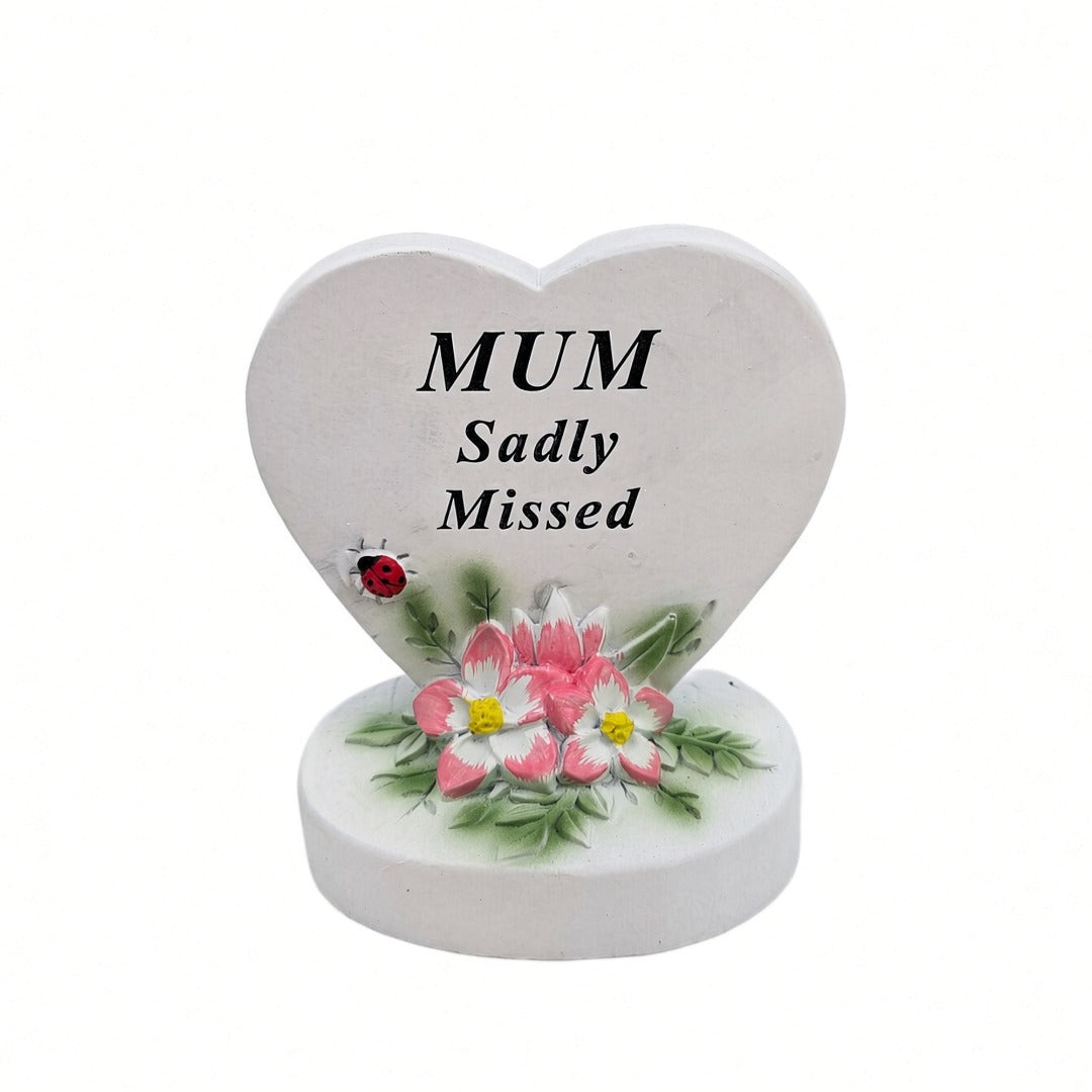 Mum Sadly Missed white heart memorial with pink flowers front view