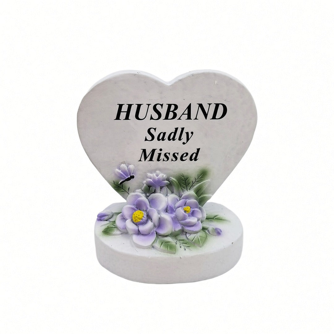 Husband Sadly Missed white heart memorial with purple flowers front view