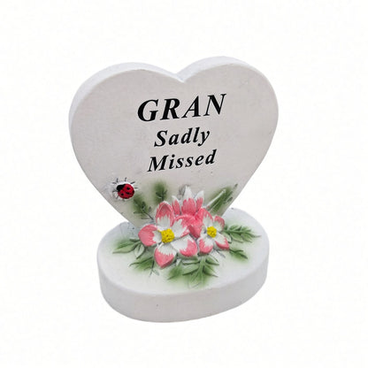 Gran Sadly Missed white heart memorial with pink flowers
