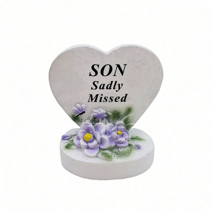 Son Sadly Missed white heart memorial with purple flowers front view