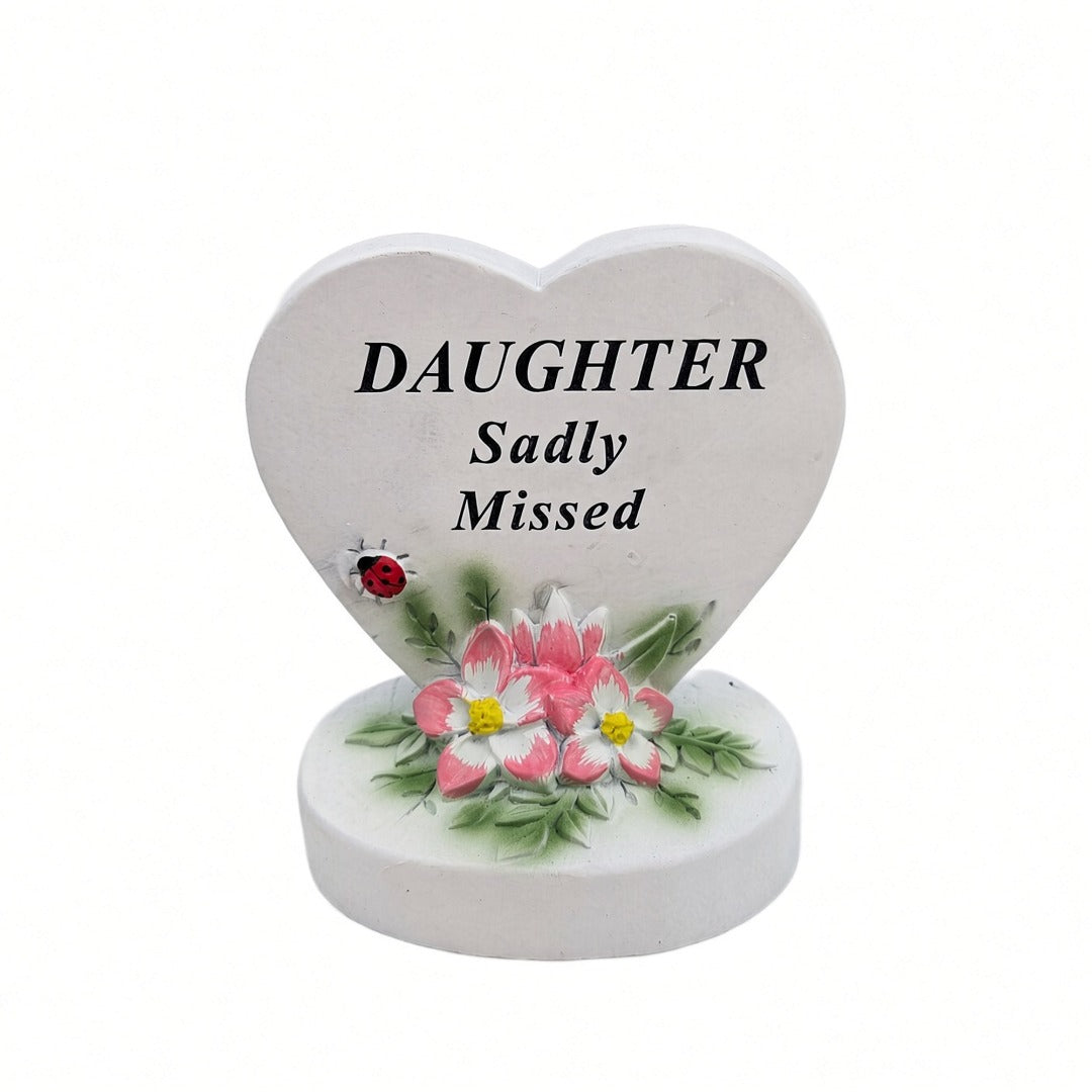 Daughter Sadly Missed white heart memorial with pink flowers front view