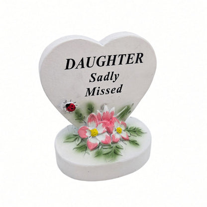 Daughter Sadly Missed white heart memorial with pink flowers