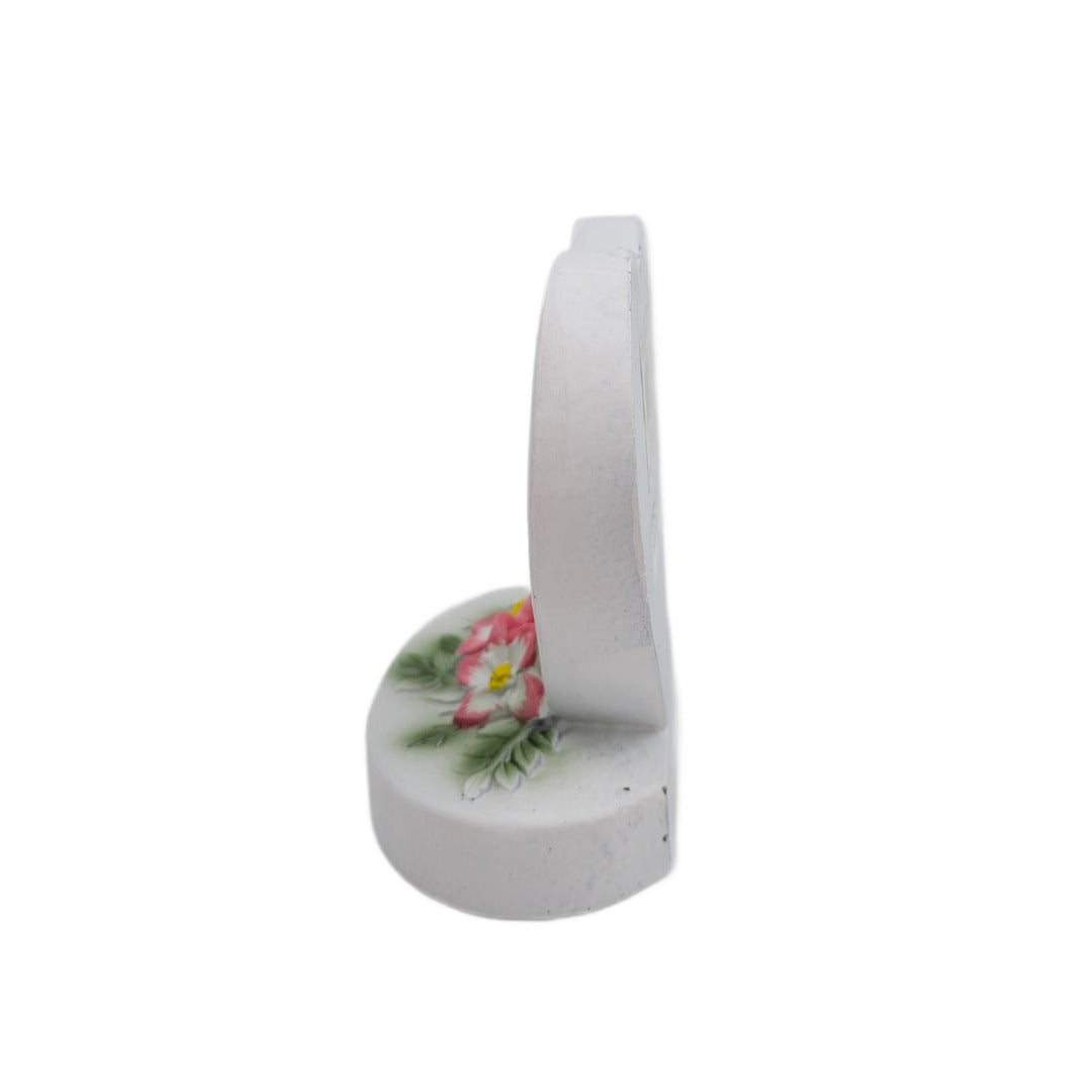 Daughter Sadly Missed white heart memorial with pink flowers side view