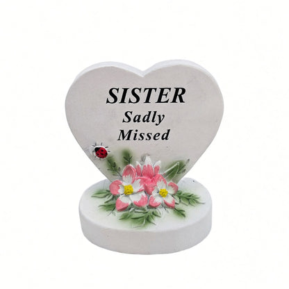 Sister Sadly Missed white heart memorial with pink flowers front view