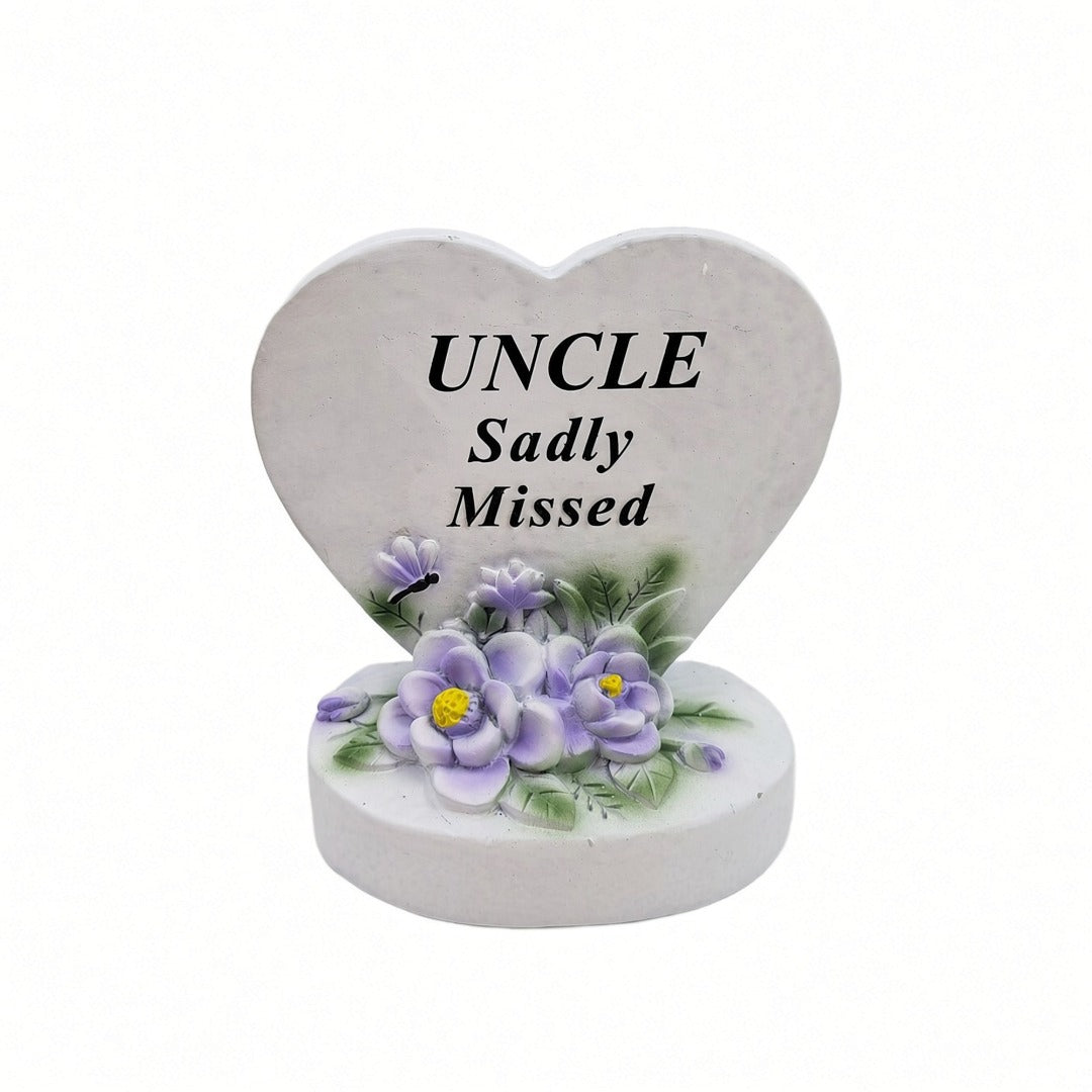 Uncle Sadly Missed white heart memorial with purple flowers front view