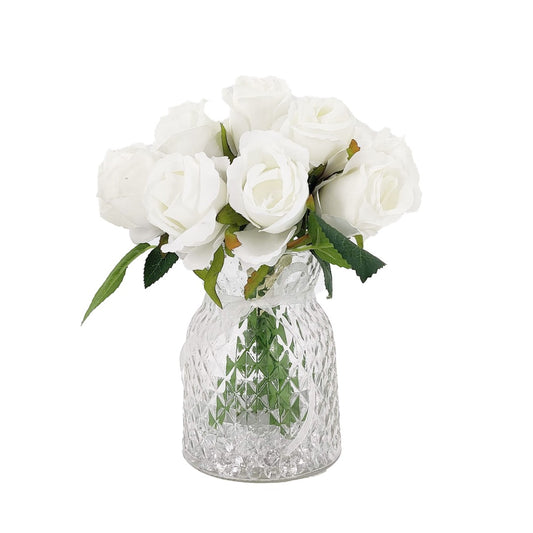 White artificial bud rose arrangement in textured glass vase
