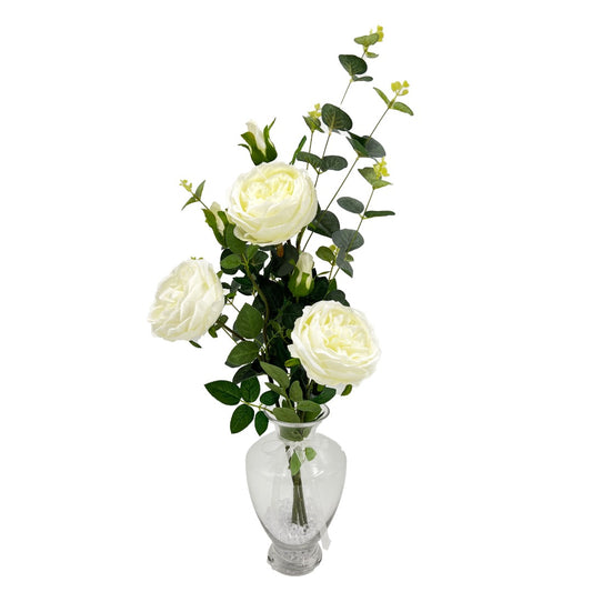 White English rose artificial flowers in a tall glass vase